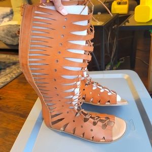 NWT Torrid brown, tall lace up sandals.  Has a zipper in back. Size 11.5
